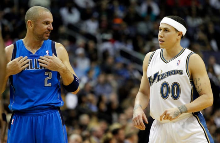 Dallas Mavericks point guard Jason Kidd (2) talks with Washington Wizards point guard Mike Bibby (0) in the first half at Verizon Center.